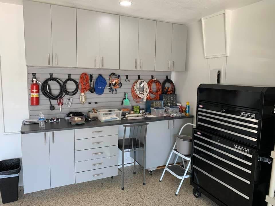 Garage cabinets with slatwall system on the back splash